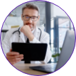Male doctor using a tablet