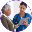 Nurse discussing information with an elderly patient