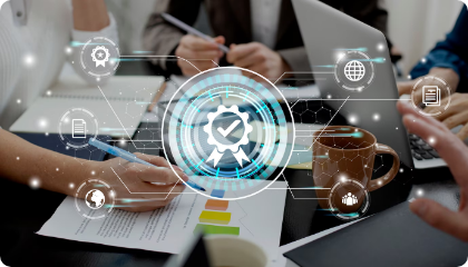 Close-up of hands taking notes on paper surrounded by laptops and coffee mugs, overlaid with digital icons symbolizing quality assurance and process optimization.